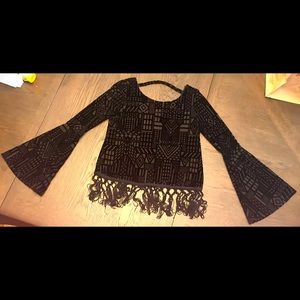 Black long sleeve top with fringe bottom